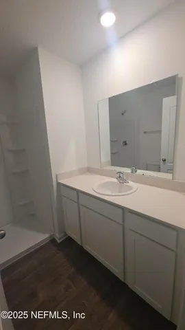 a bathroom with a sink and a mirror