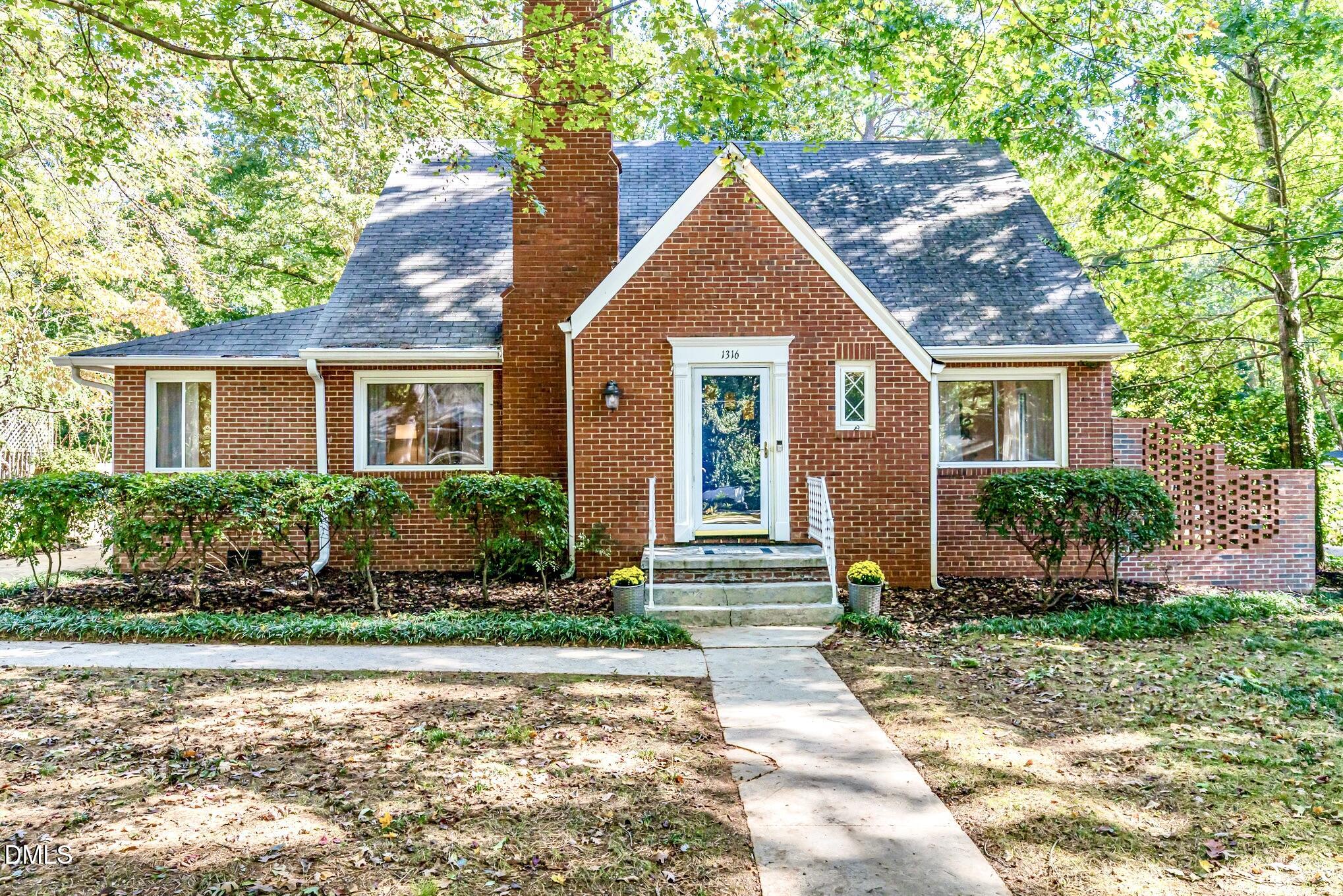 1316 Dixie Trail Raleigh, NC 27607 - Photo 1 of 36 front view of a house and a yard