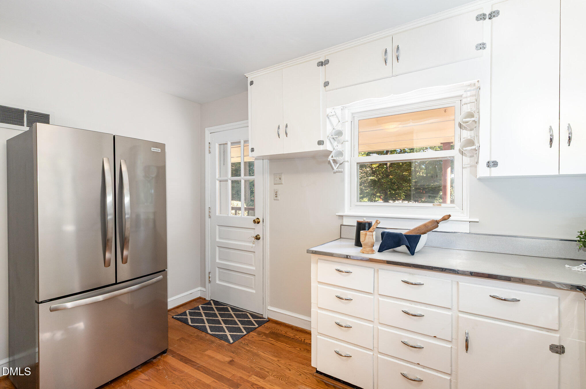 1316 Dixie Trail Raleigh, NC 27607 - Photo 11 of 36 a kitchen with appliances cabinets and a window