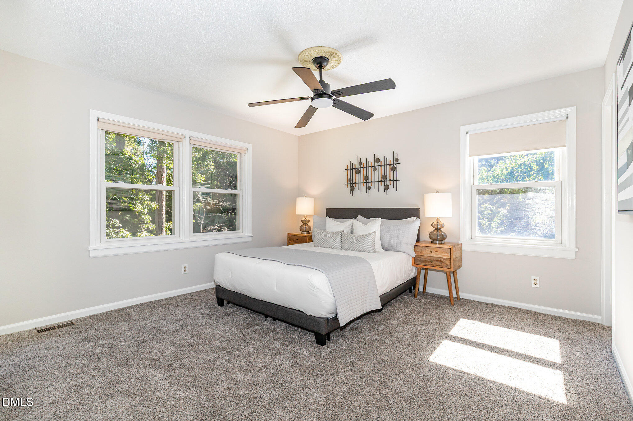 1316 Dixie Trail Raleigh, NC 27607 - Photo 16 of 36 a spacious bedroom with a bed and window