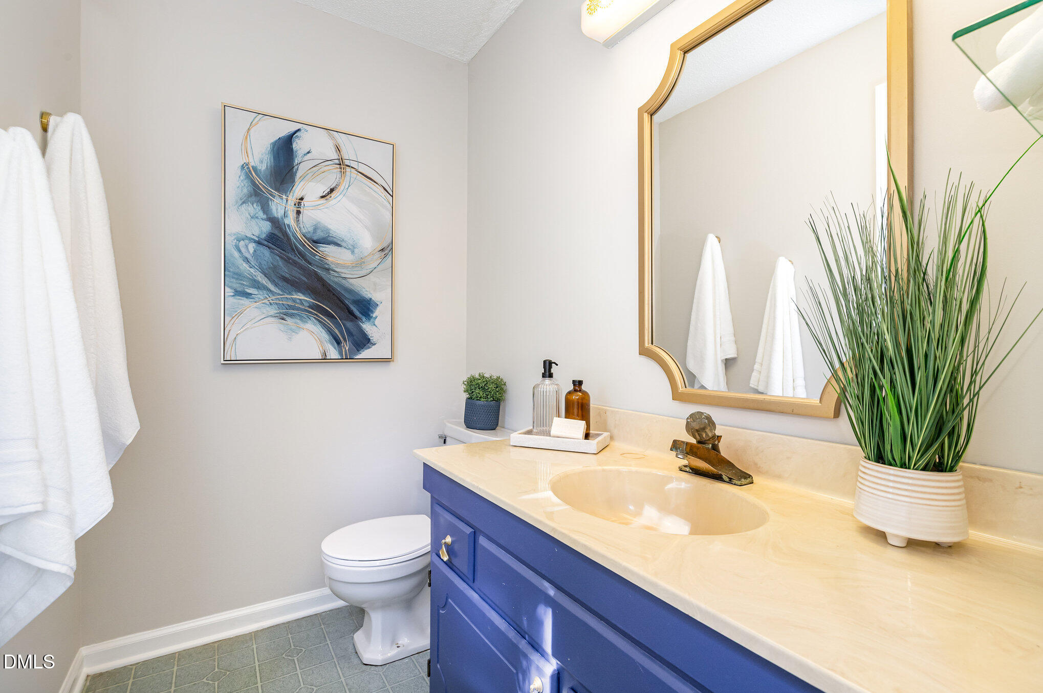 1316 Dixie Trail Raleigh, NC 27607 - Photo 17 of 36 a bathroom with a toilet a sink and mirror