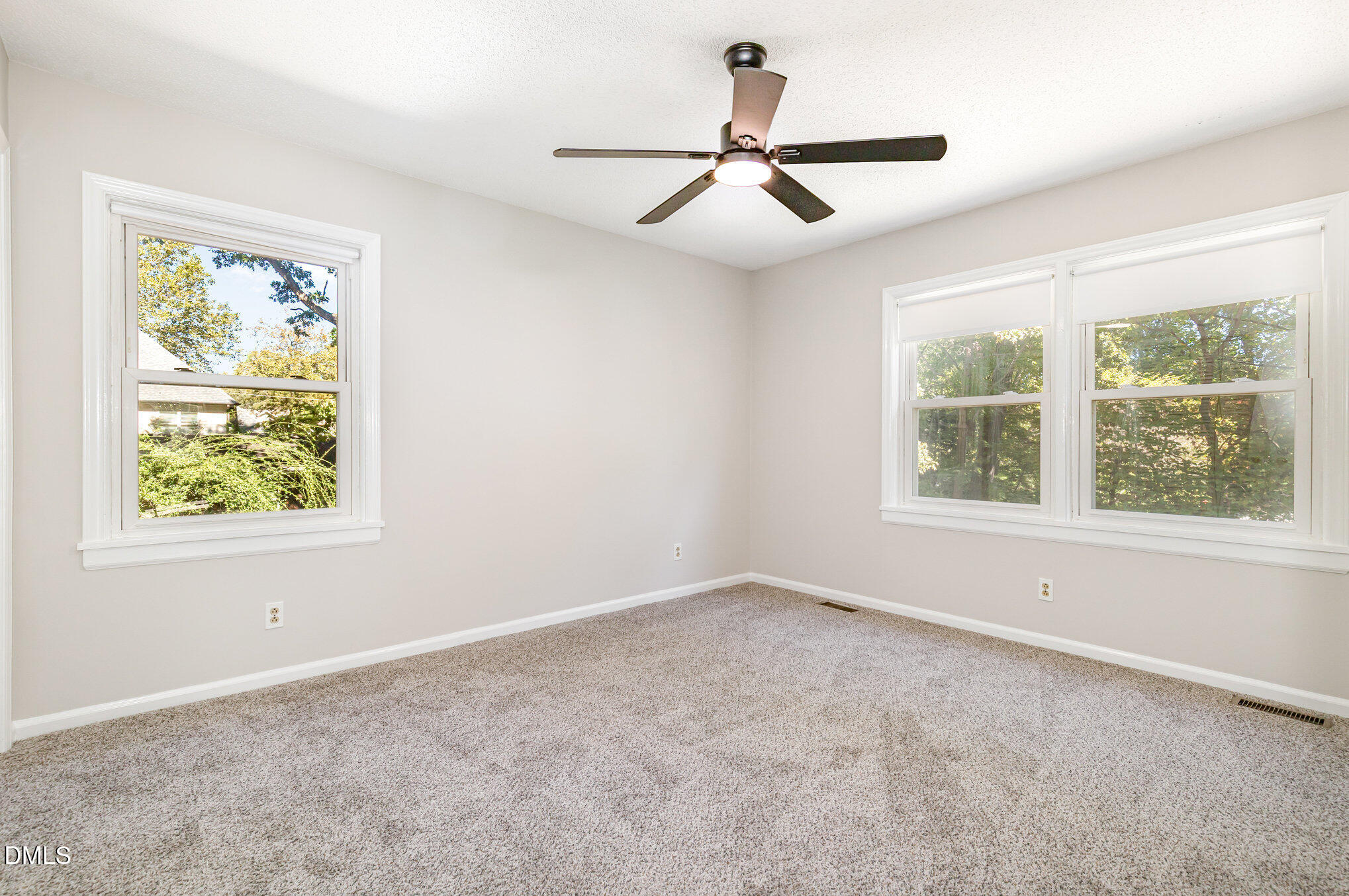 1316 Dixie Trail Raleigh, NC 27607 - Photo 19 of 36 a view of room with window and ceiling fan