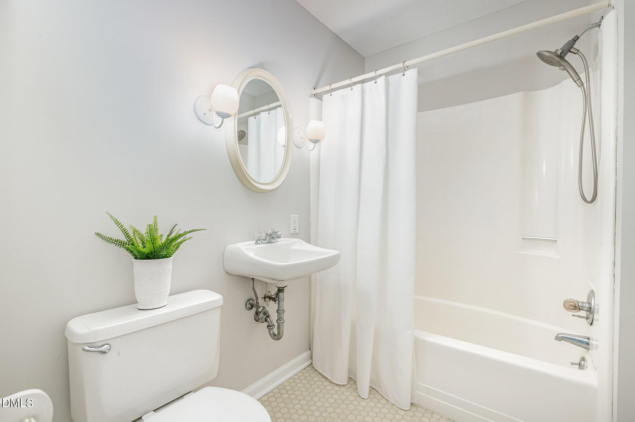 1316 Dixie Trail Raleigh, NC 27607 - Photo 20 of 36 a bathroom with a sink toilet and shower