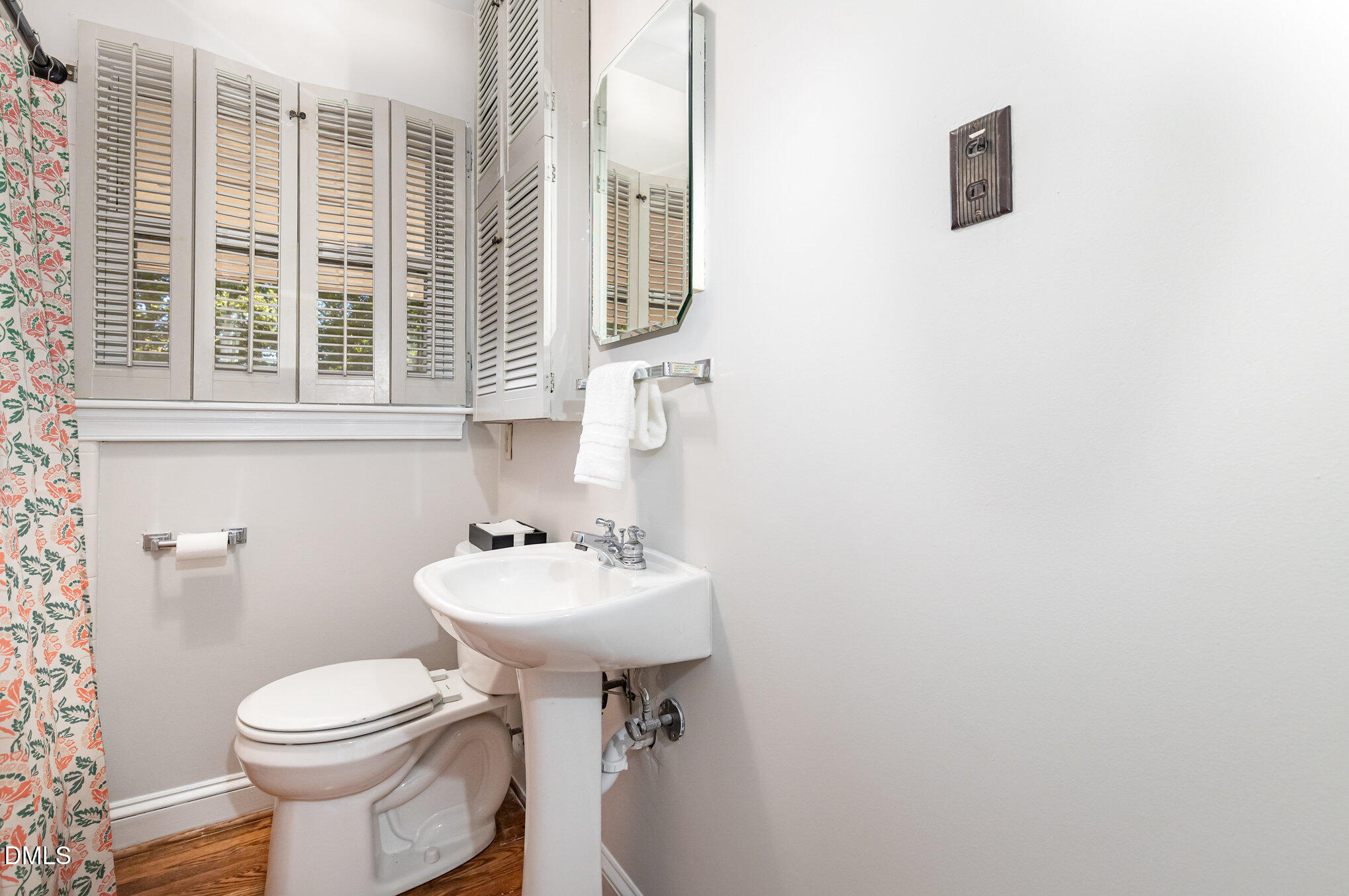1316 Dixie Trail Raleigh, NC 27607 - Photo 26 of 36 a bathroom with a sink mirror toilet and next to a window