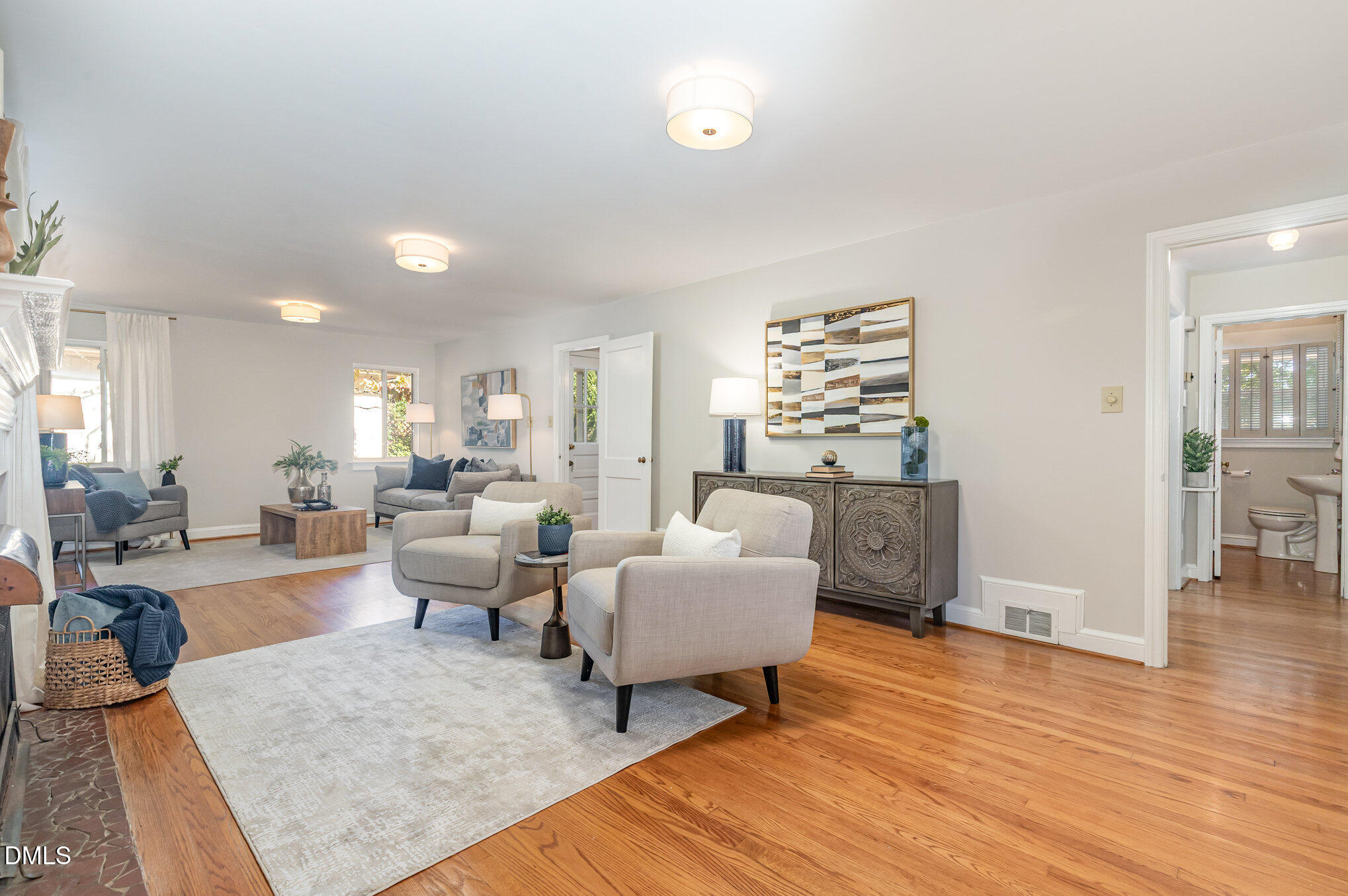 1316 Dixie Trail Raleigh, NC 27607 - Photo 3 of 36 a living room with furniture and a wooden floor