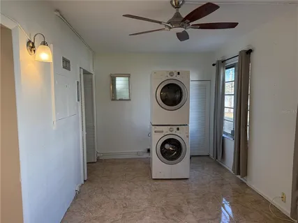 a view of a hallway with washer and dryer
