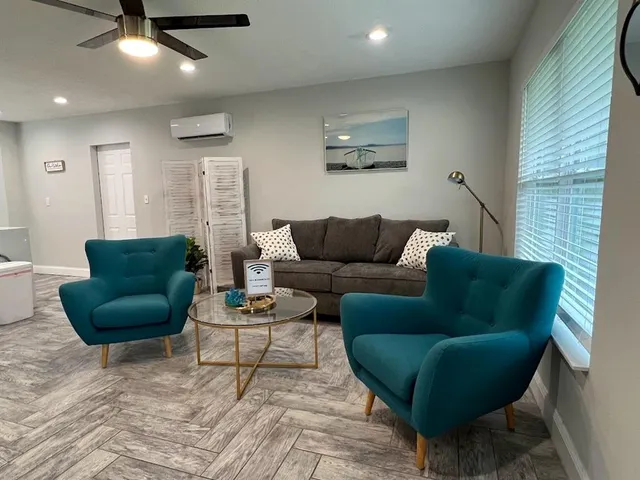 a living room with furniture and a rug