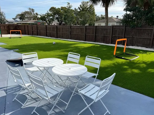 a view of a yard with furniture