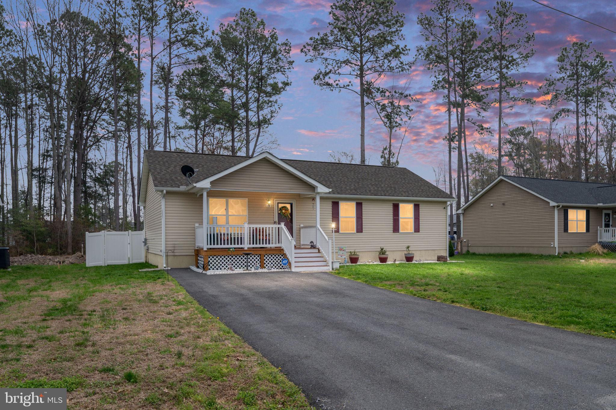 78 Rustic Lane Colonial Beach, VA 22443 - Photo 2 of 56 Charming home at sunset, serene setting.
