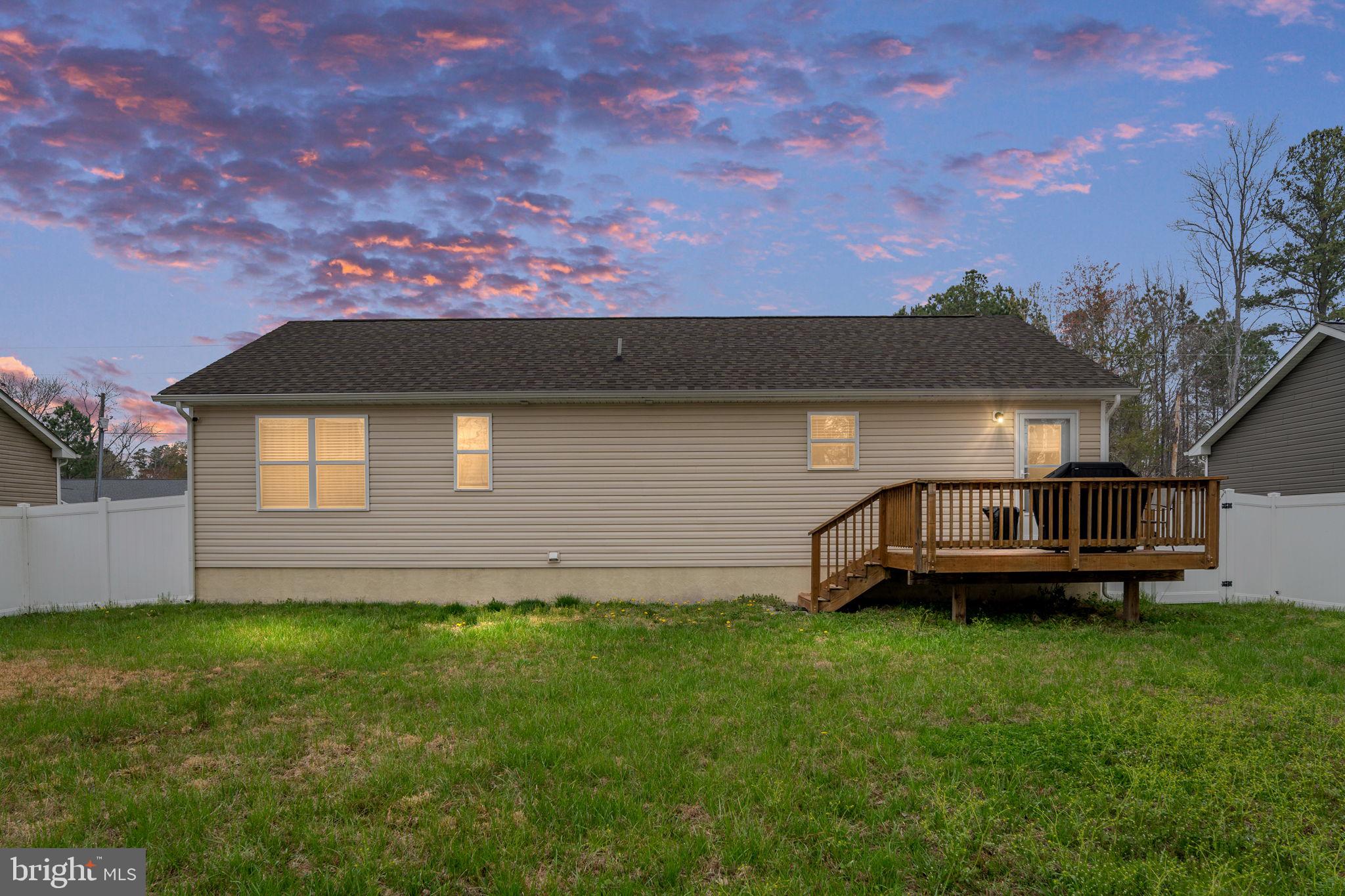 78 Rustic Lane Colonial Beach, VA 22443 - Photo 3 of 56 Charming home with sunset backdrop.