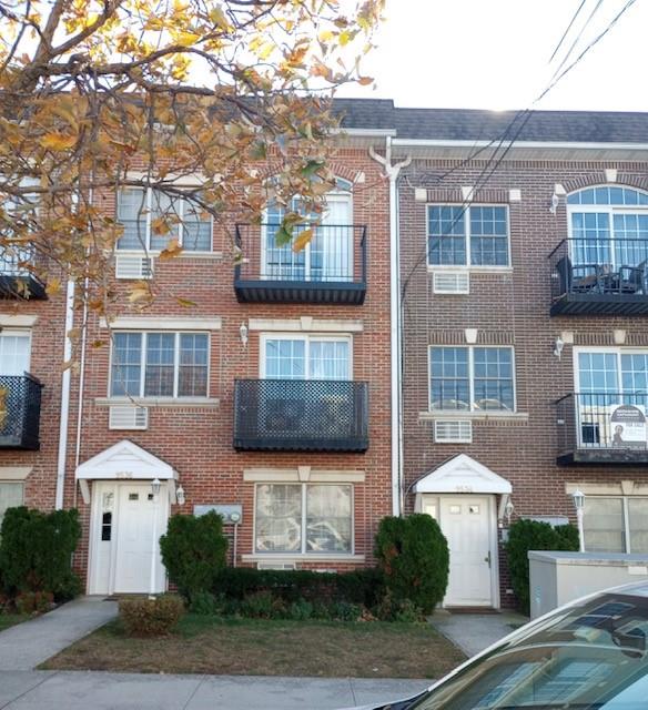 9536 Schenck Street, Unit 3 Brooklyn, NY 11236 - Photo 2 of 3 a front view of a house with a yard