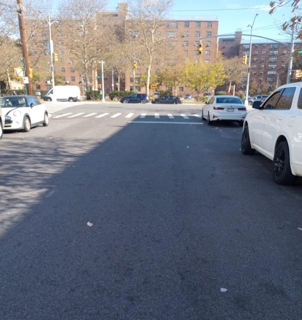 9536 Schenck Street, Unit 3 Brooklyn, NY 11236 - Photo 3 of 3 a view of a city street with a cars park