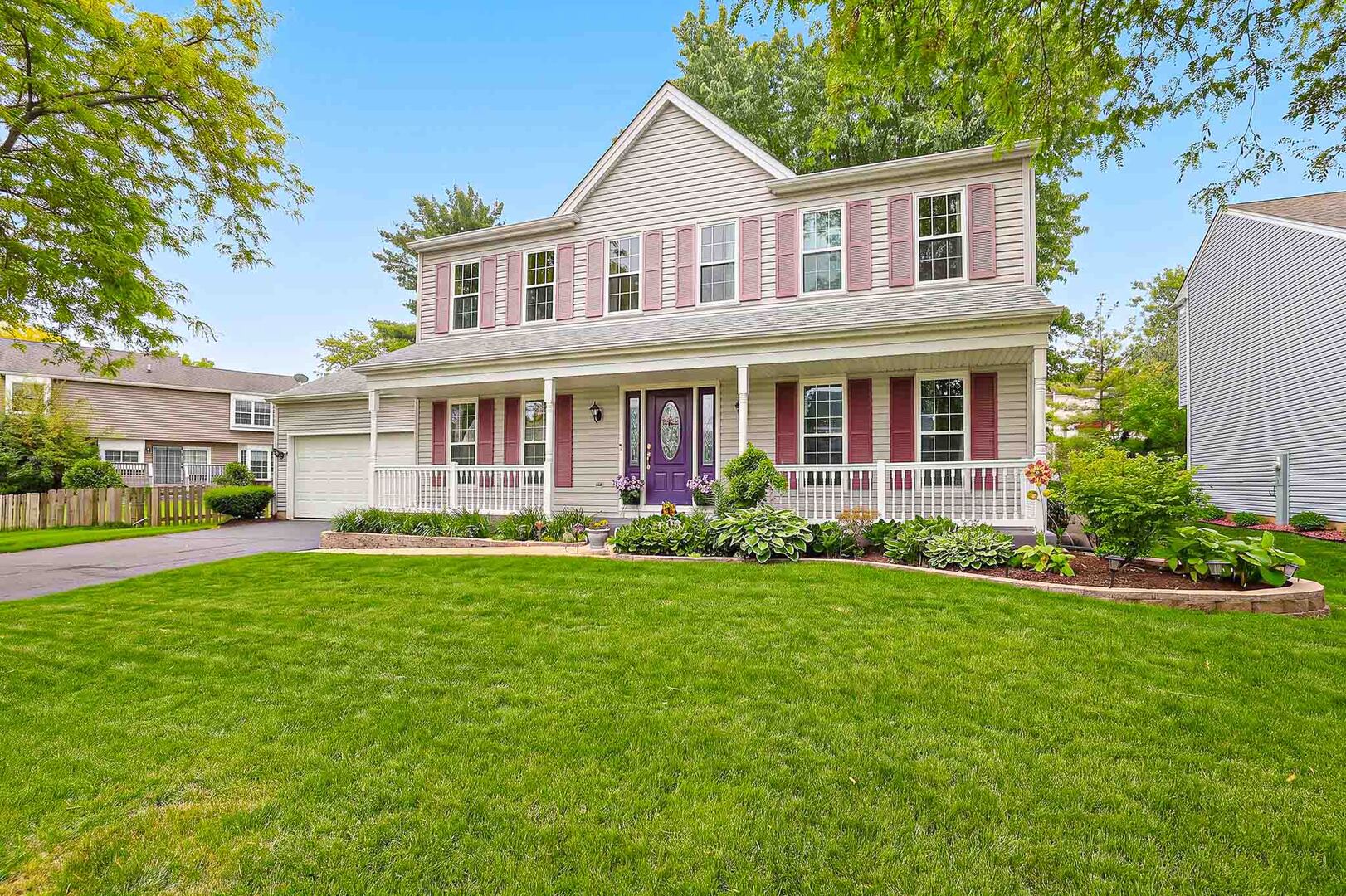 830 Hawk Lane Carol Stream, IL 60188 - Photo 3 of 30 a front view of a house with a yard and porch