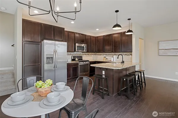 a white toilet sitting next to a white sink