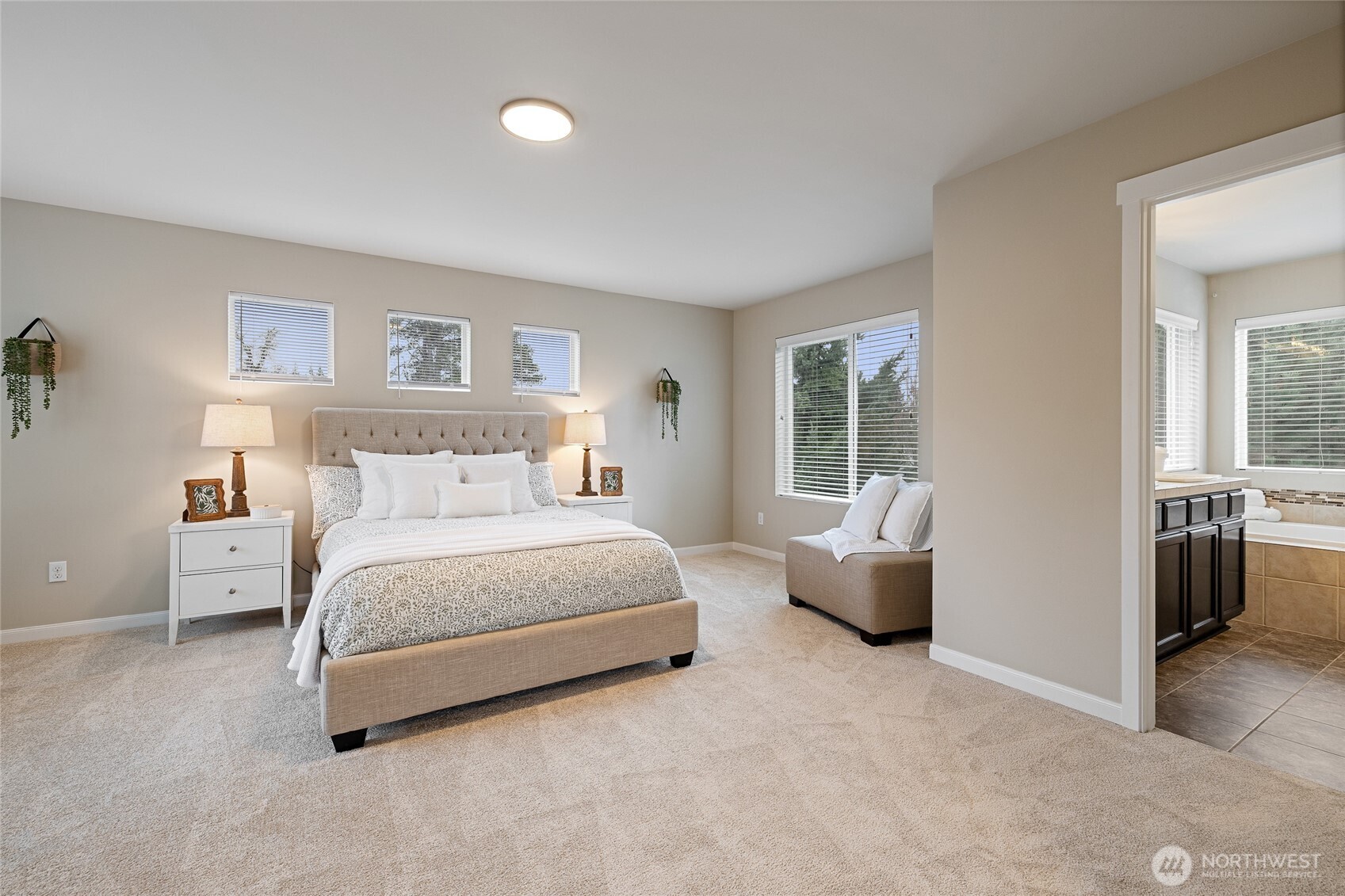 1016 207th Street Southwest Lynnwood, WA 98036 - Photo 16 of 39 a spacious bedroom with a bed and a couch
