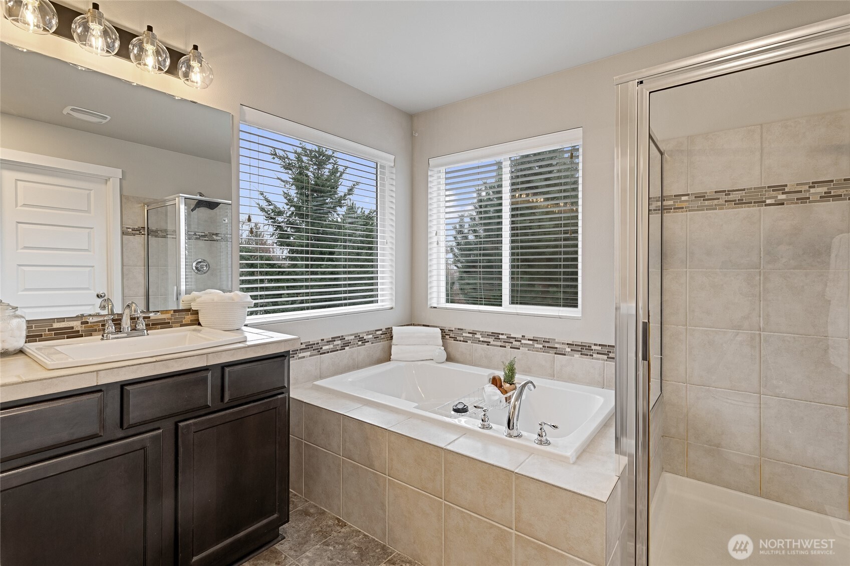 1016 207th Street Southwest Lynnwood, WA 98036 - Photo 21 of 39 a bathroom with a tub sink and mirror