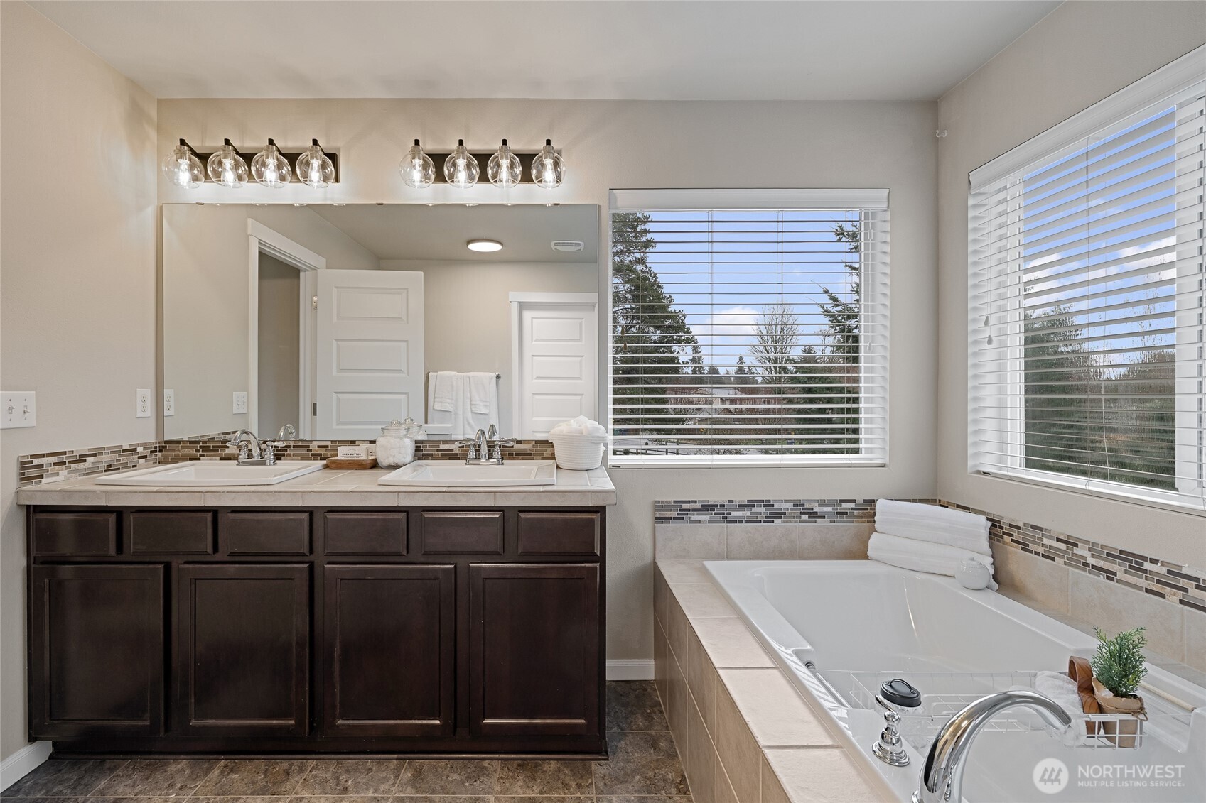 1016 207th Street Southwest Lynnwood, WA 98036 - Photo 22 of 39 a bathroom with a tub sink and mirror