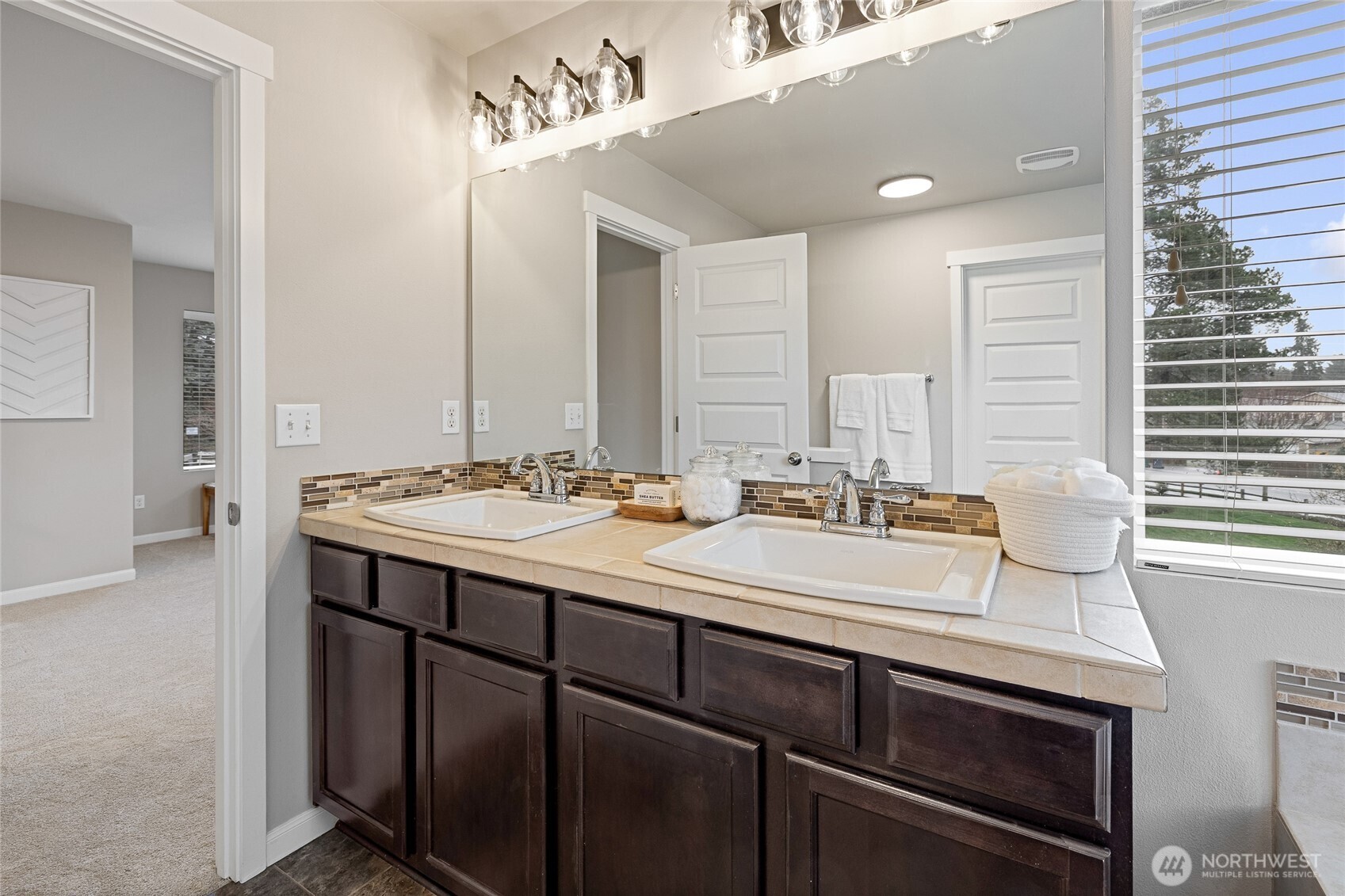 1016 207th Street Southwest Lynnwood, WA 98036 - Photo 23 of 39 a bathroom with a sink double vanity and a mirror