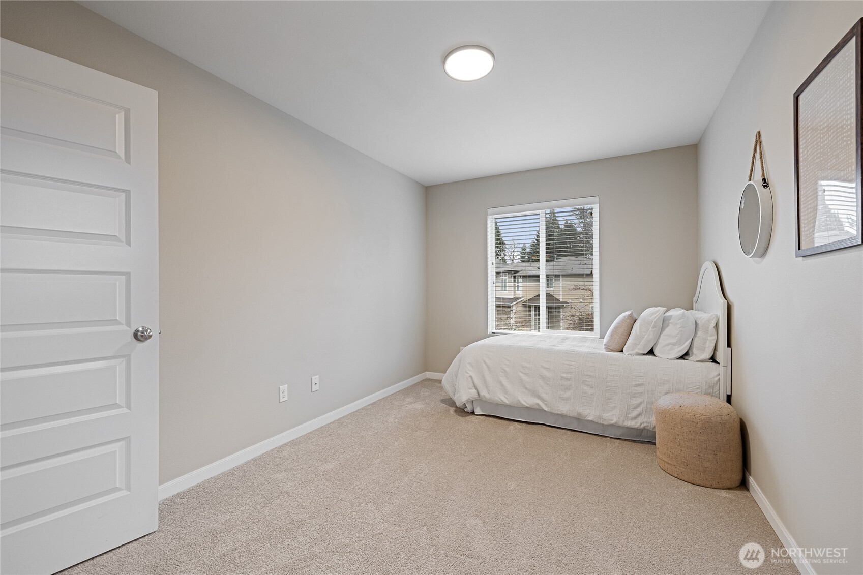1016 207th Street Southwest Lynnwood, WA 98036 - Photo 26 of 39 a bedroom with a bed and a window