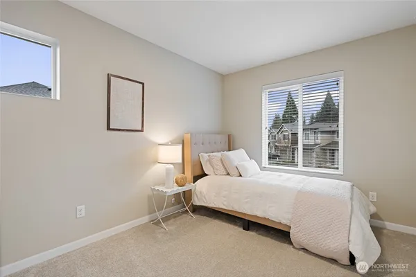 a bedroom with a bed and a couch