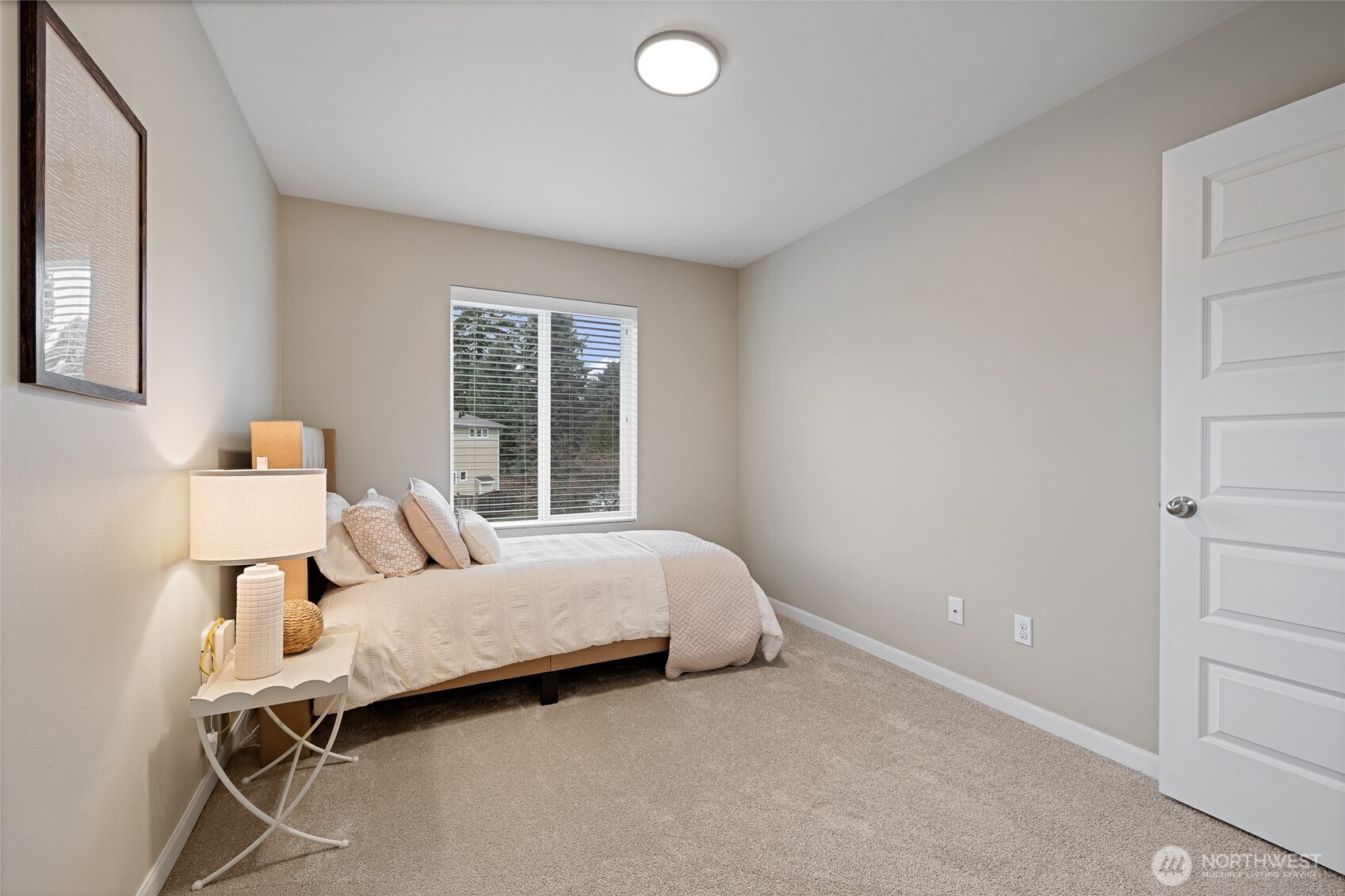 1016 207th Street Southwest Lynnwood, WA 98036 - Photo 29 of 39 a bedroom with a bed and a window