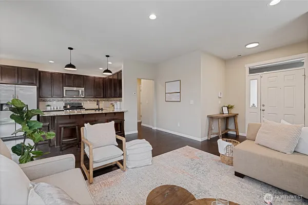 a living room with furniture fireplace and a table