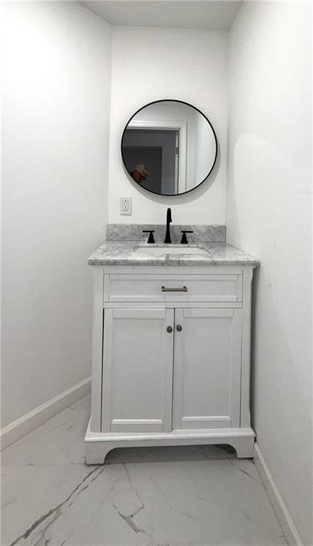 3367 Ridgway Street Pittsburgh, PA 15213 - Photo 11 of 16 a room with a sink and mirror