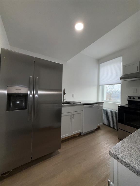 3367 Ridgway Street Pittsburgh, PA 15213 - Photo 8 of 16 a kitchen with stainless steel appliances granite countertop a refrigerator a sink and wooden cabinets