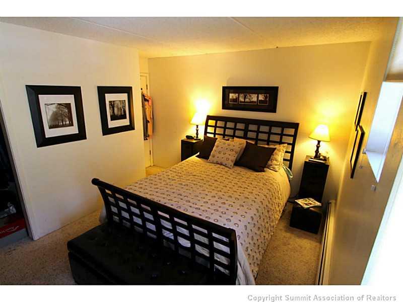 800 Copper Road, Unit 178 Copper Mountain, CO 80443 - Photo 8 of 19 a bed sitting in a bedroom next to a blue wall