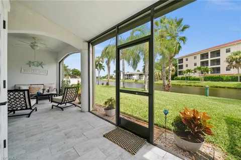 a view of a porch with furniture and garden