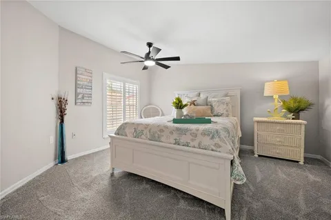 a bedroom with a bed dresser and a window