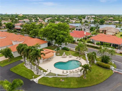 a view of a swimming pool with a yard