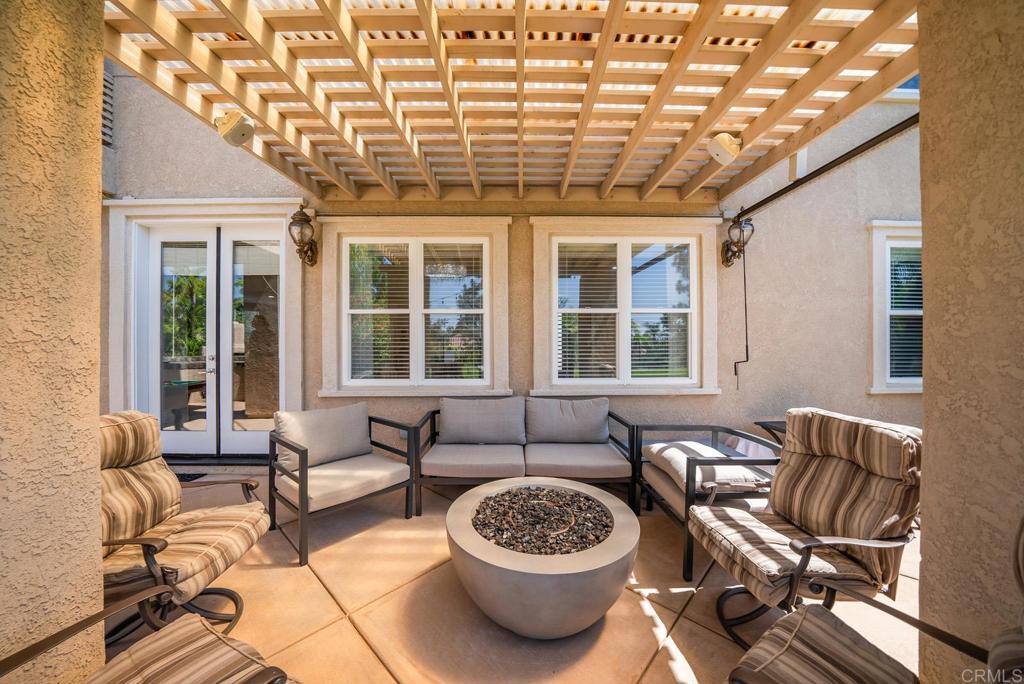 13251 Devon Drive Jamul, CA 91935 - Photo 16 of 73 a view of a patio with a dining table and chairs