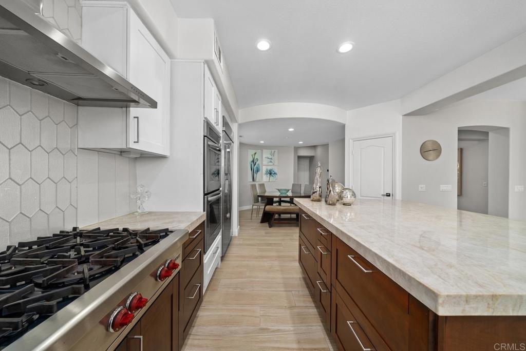 13251 Devon Drive Jamul, CA 91935 - Photo 30 of 73 a kitchen with sink stove and cabinets