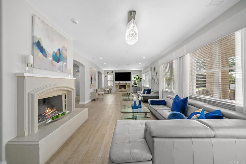 13251 Devon Drive Jamul, CA 91935 - Photo 35 of 73 a living room with furniture flat screen tv and a fireplace