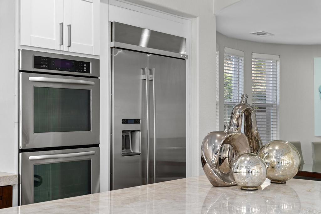 13251 Devon Drive Jamul, CA 91935 - Photo 44 of 73 a kitchen with a refrigerator and a stove top oven