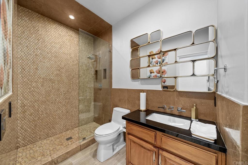 13251 Devon Drive Jamul, CA 91935 - Photo 50 of 73 a bathroom with a sink a toilet and shower