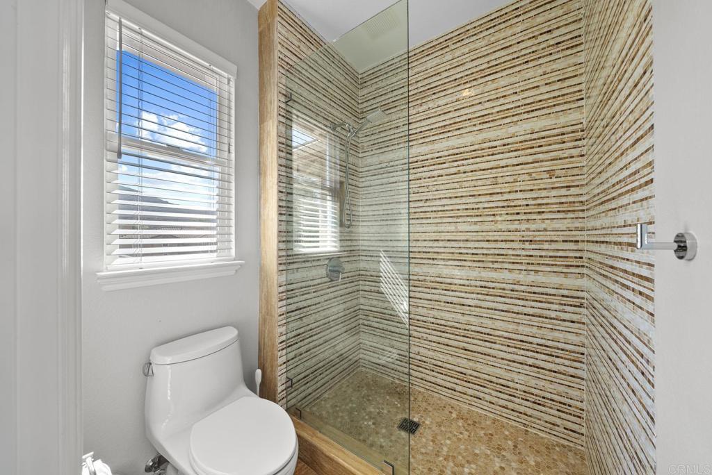 13251 Devon Drive Jamul, CA 91935 - Photo 56 of 73 a bathroom with a toilet and a shower