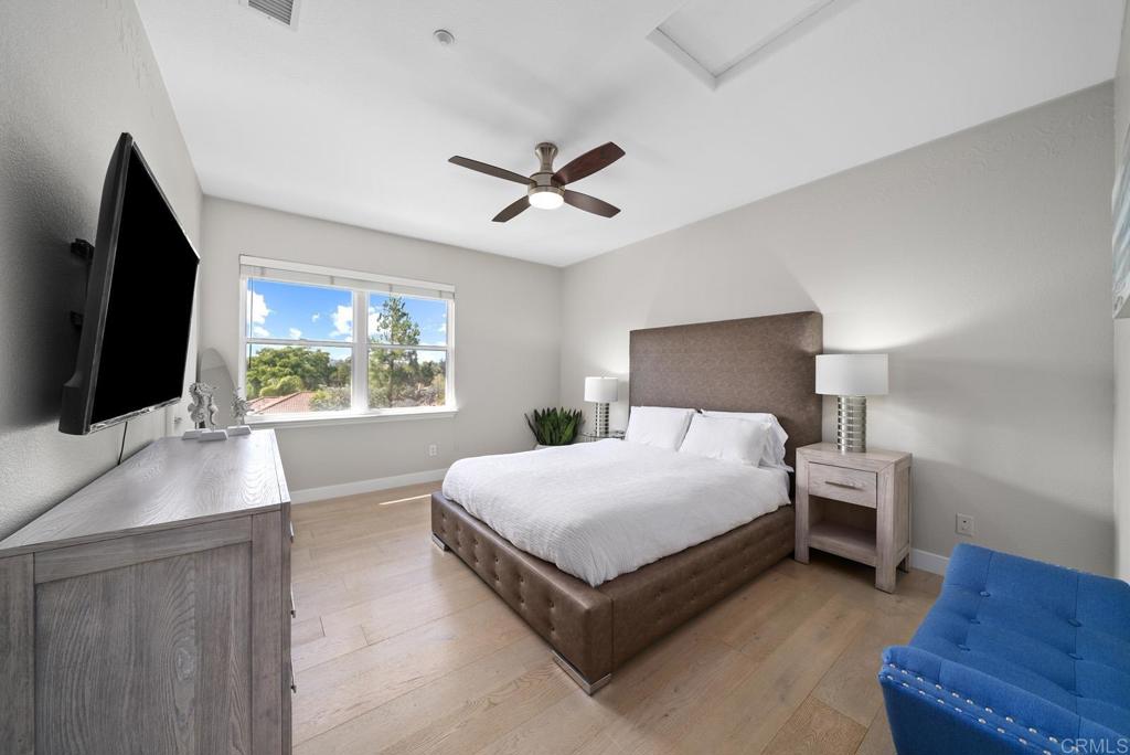 13251 Devon Drive Jamul, CA 91935 - Photo 57 of 73 a bedroom with a large bed a flat tv screen and a dresser