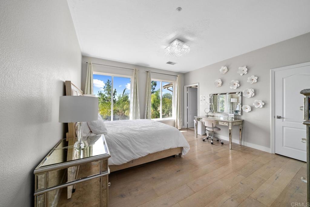 13251 Devon Drive Jamul, CA 91935 - Photo 59 of 73 a bed room with a bed and a chair