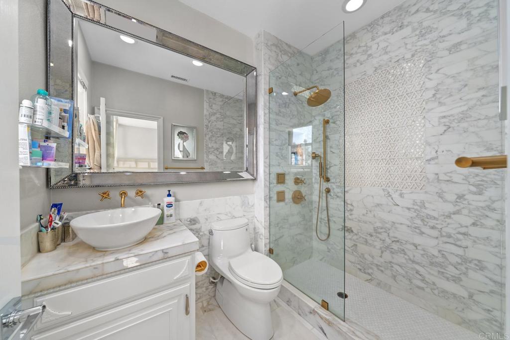 13251 Devon Drive Jamul, CA 91935 - Photo 60 of 73 a bathroom with a sink a toilet and shower