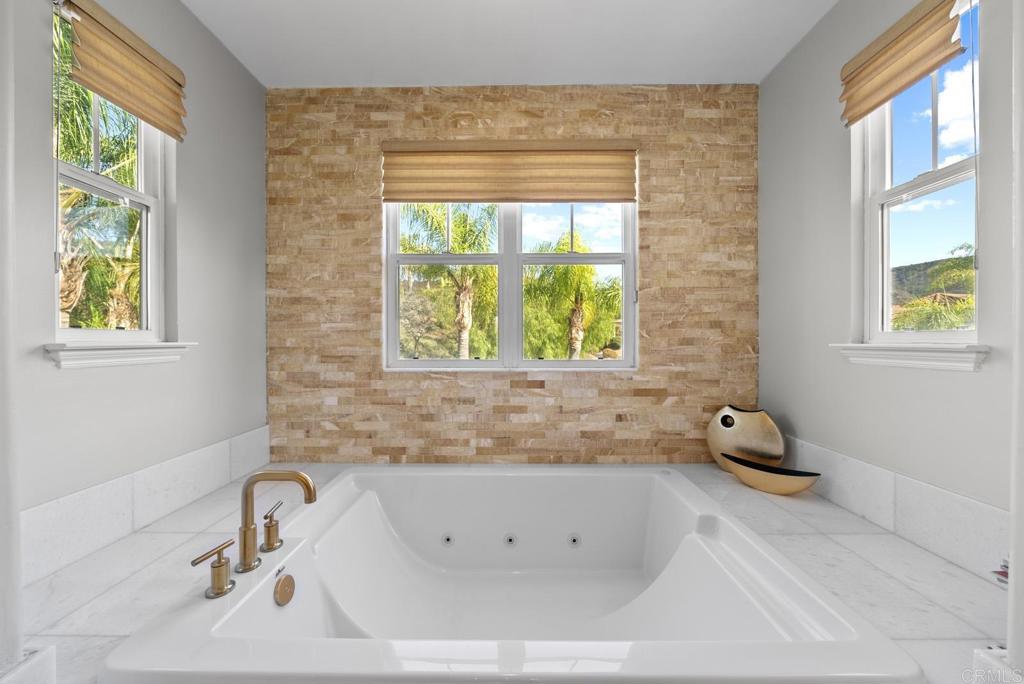 13251 Devon Drive Jamul, CA 91935 - Photo 69 of 73 a bathroom with a tub sink and a window