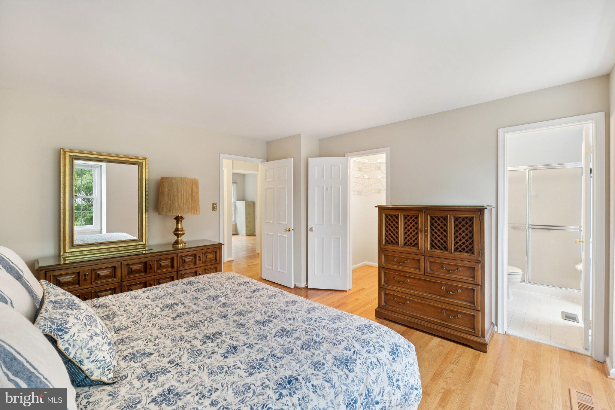 7904 Jensen Place Bethesda, MD 20817 - Photo 13 of 22 a bedroom with a bed and a dresser