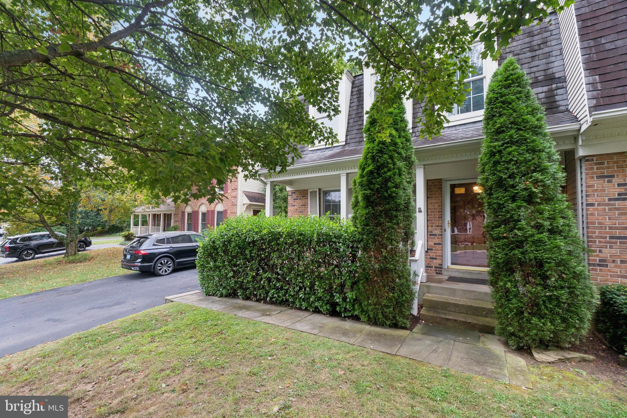 7904 Jensen Place Bethesda, MD 20817 - Photo 2 of 22 a front view of a house with a garden