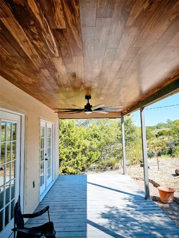 a living room with lots of furniture and a chandelier