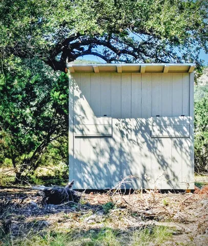 a table and chairs in the outdoor space