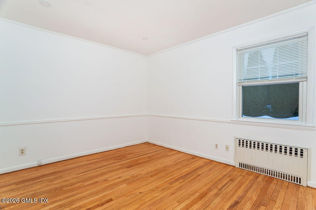 198 Valley Road Cos Cob, CT 06807 - Photo 13 of 31 a view of an empty room and wooden floor