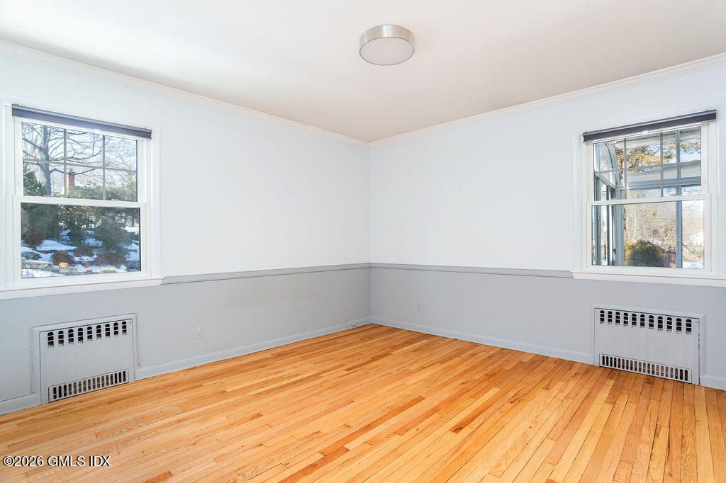 198 Valley Road Cos Cob, CT 06807 - Photo 17 of 31 a view of an empty room with wooden floor and a window