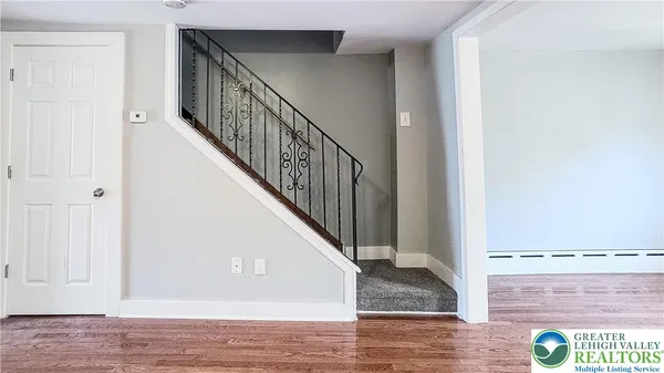 a view of entryway with wooden floor