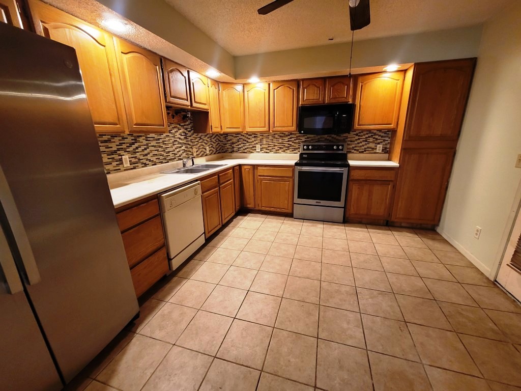 2601 Rachel Road Champaign, IL 61822 - Photo 10 of 22 a kitchen with stainless steel appliances a refrigerator sink and microwave